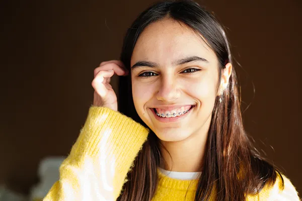 Knowing how to care for braces and retainers is crucial for the best orthodontic treatment as this girl knows 