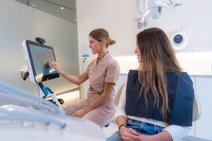 Orthodontist and patient reviewing digital Invisalign scan at Kendrick Orthodontics, Kissimmee FL.